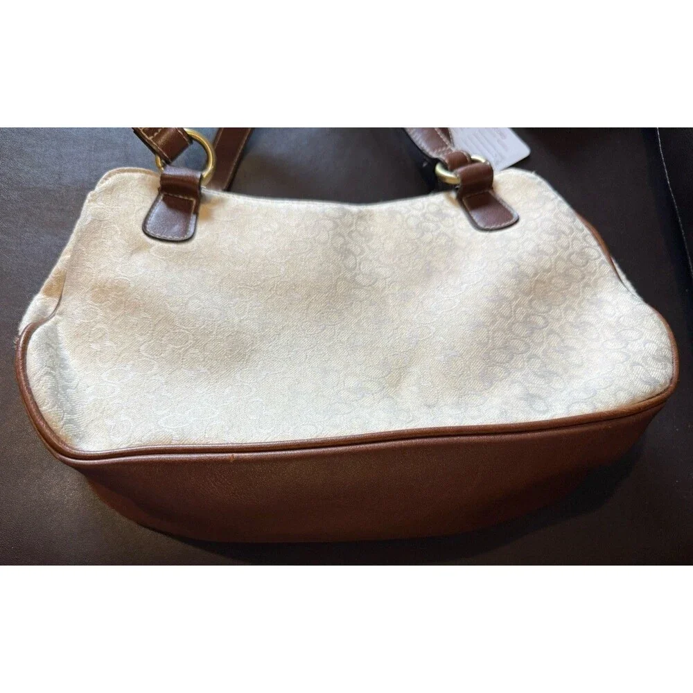 Rosetti shoulder bag with matching wallet in a white and brown color scheme.